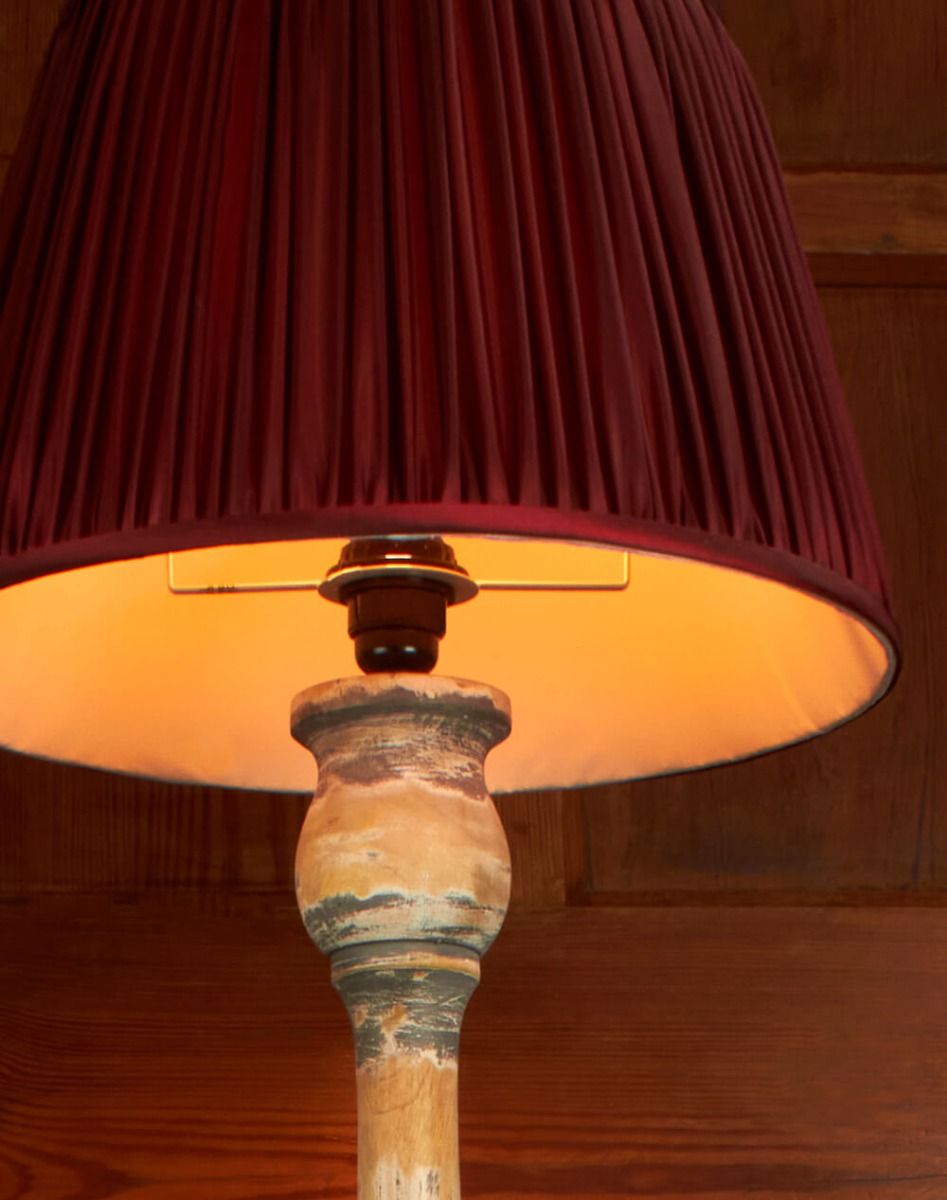 Floor lamp with wooden stand and burgundy silk shade