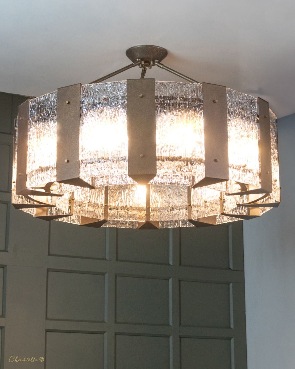 textured glass chandelier with antique metalwork