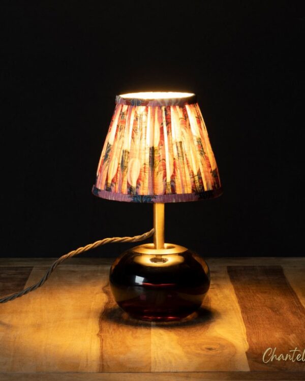Brass and magenta glass table lamp with patterned pleated shade and flower cut backplate - 074824