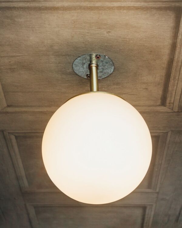 Brushed brass flush ceiling light with opal glass globe - 057015