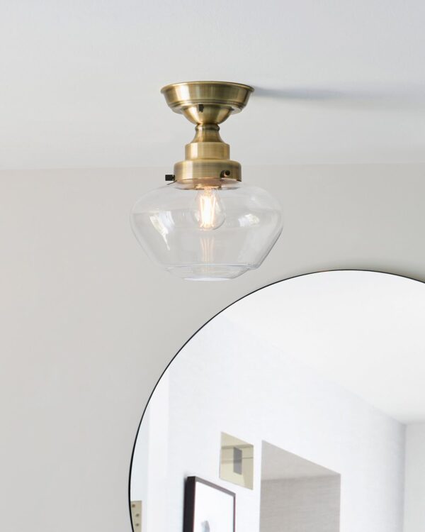 Timeless antique brass semi flush ceiling light with a clear glass shade - 072866
